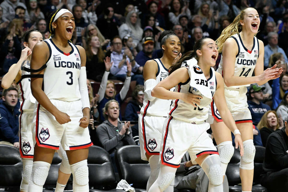 UConn's Aaliyah Edwards, Aubrey Griffin, Nika Muhl, and Dorka Juhasz, from left cheer during the second half of an NCAA college basketball game against Marquette in the semifinals of the Big East Conference tournament at Mohegan Sun Arena, Sunday, March 5, 2023, in Uncasville, Conn. (AP Photo/Jessica Hill)