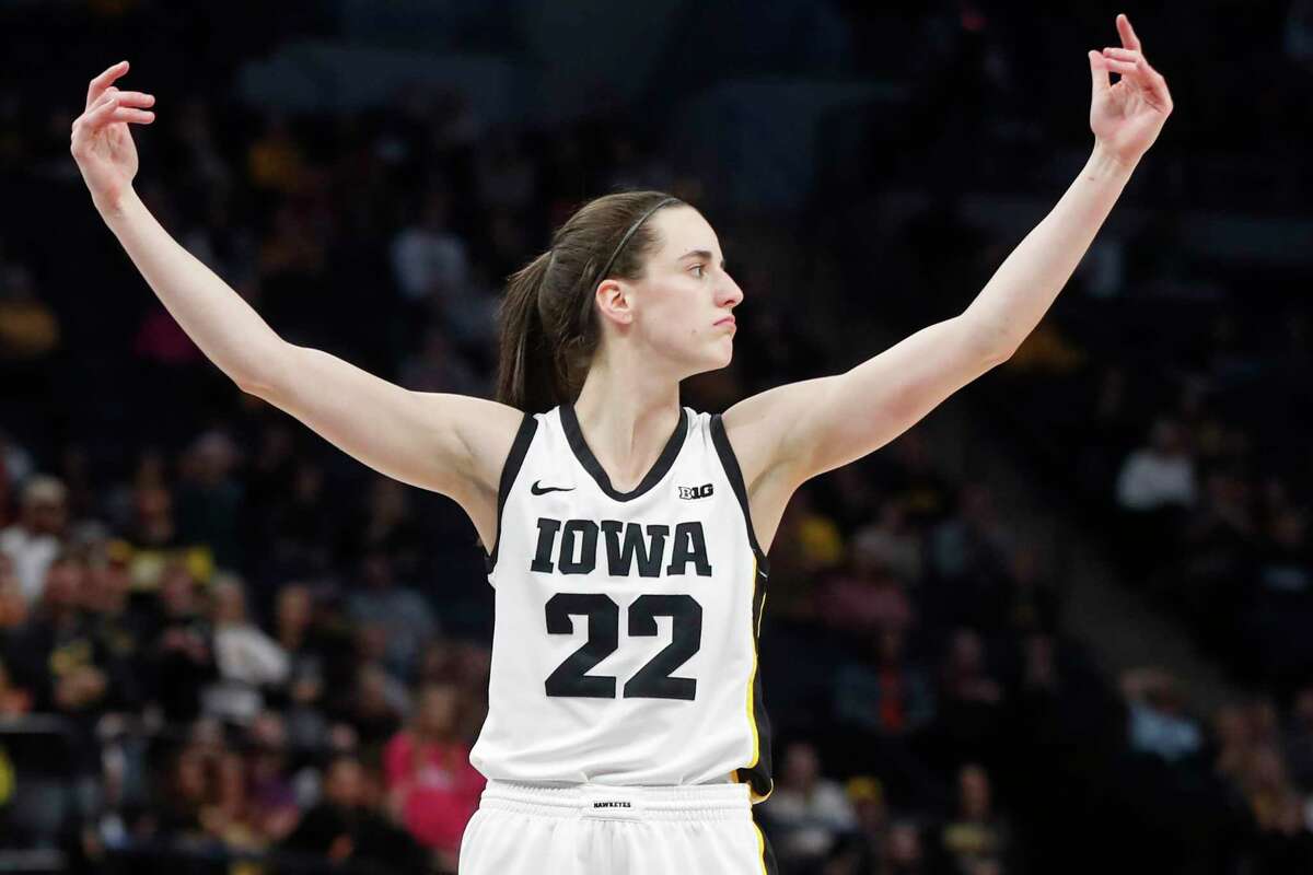 Iowa guard Caitlin Clark calls to the crowd for support after making two intentional foul free throws against Ohio State in the second half of an NCAA college basketball championship game at the Big Ten women's tournament Sunday, March 5, 2023, in Minneapolis. Iowa won 105-72.