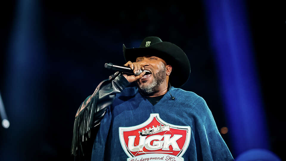 Bun B onstage in a UGK poncho during his RodeoHouston Southern Takeover.