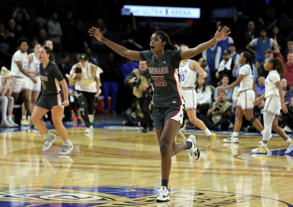 Washington State’s Bella Murekatete celebrates after time expired in the Cougars’ 65-61 victory over UCLA in Las Vegas.