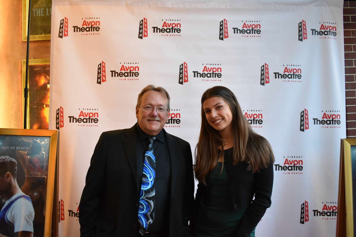 Jim Miller, the director of bands at Frank Scott Bunnell High School in Stratford, and Paige Jockers, a student at Bunnell, attend a private screening of "Chang Can Dunk" at Stamford's Avon Theater.