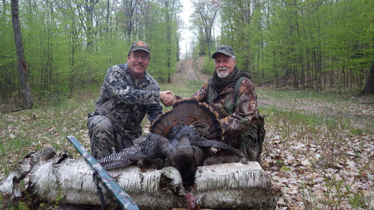Hunting guides Gary Morgan, left, and John Jones met by chance in the Atlanta, Michigan woods one evening in 2015, and joined forces the following morning to call in a wild gobbler for writer Tom Lounsbury.