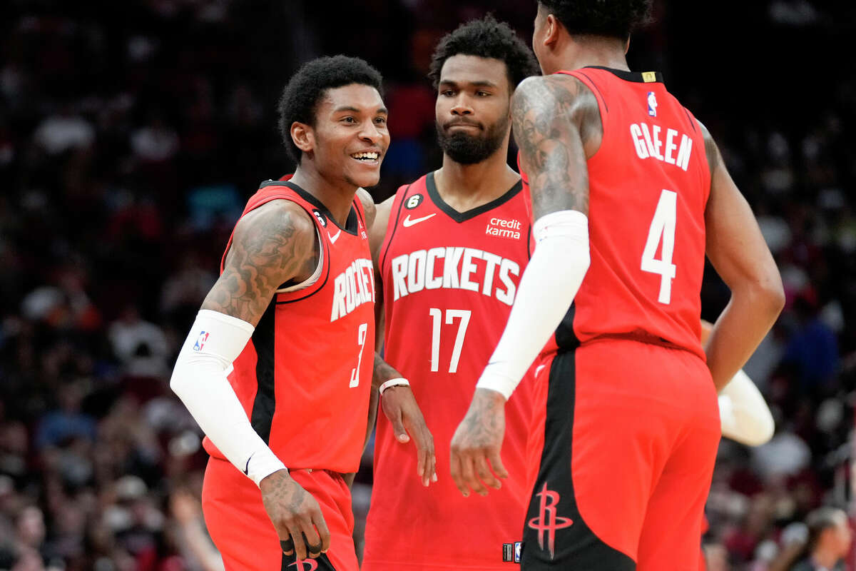 Houston Rockets guard Kevin Porter Jr., left, celebrates after his 3-point basket with Tari Eason (17) and Jalen Green (4) during the first half of an NBA basketball game against the San Antonio Spurs, Sunday, March 5, 2023, in Houston.