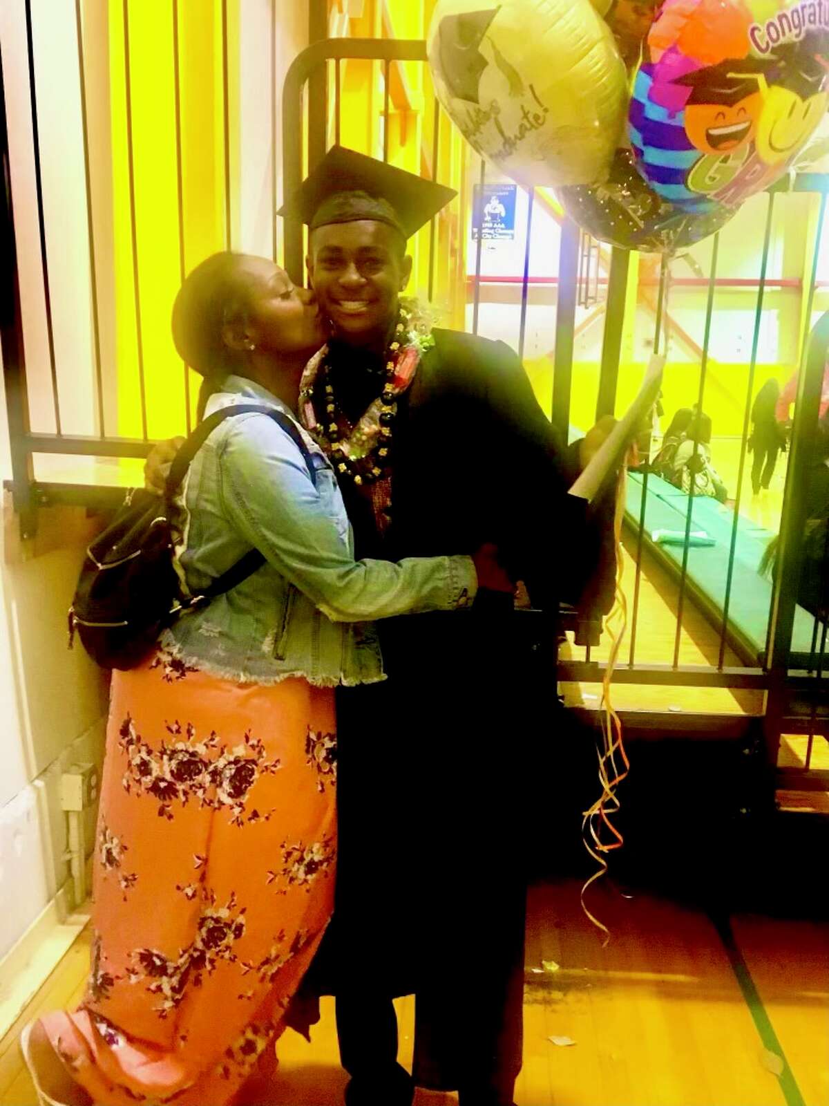 Sha’ray Johnson with her son, Day’Von Lorall Hann, after his graduation from Bessie Carmichael Middle School in San Francisco. Day’Von was shot to death at age 15 in San Francisco in 2019.