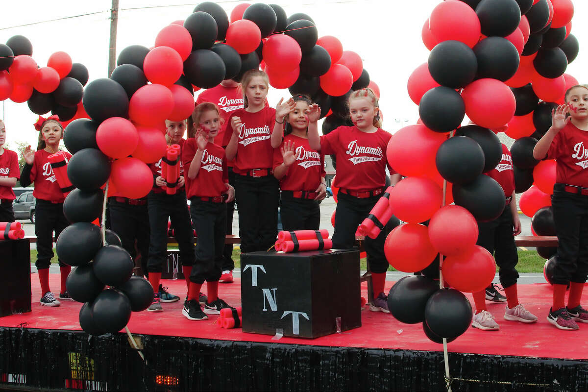 Members of the Friendswood Dynamite youth league baseball team wave to the crowd during the youth sports parade in 2019. This year's parade is scheduled for March 25.