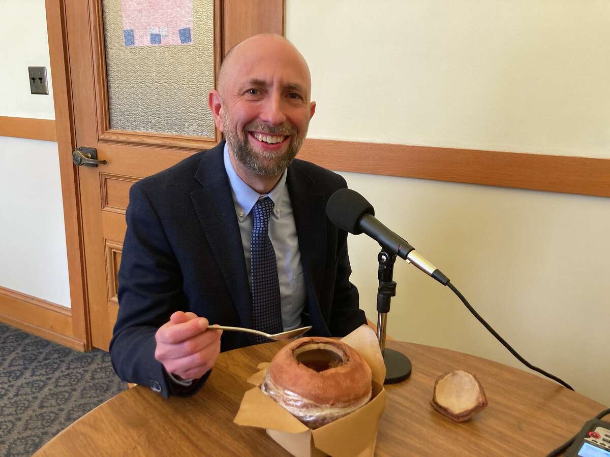 District 4 Supervisor Joel Engardio enjoys a bowl of stewed lemongrass coconut chicken soup — served in a coconut — during the recording of Soup With the Supes at City Hall on Feb. 1.