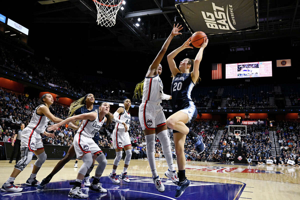 Villanova's Maddy Siegrist (20) shoots over UConn's Aaliyah Edwards during the first half of an NCAA college basketball game in the finals of the Big East Conference tournament Monday, March 6, 2023, in Uncasville, Conn. (AP Photo/Jessica Hill)