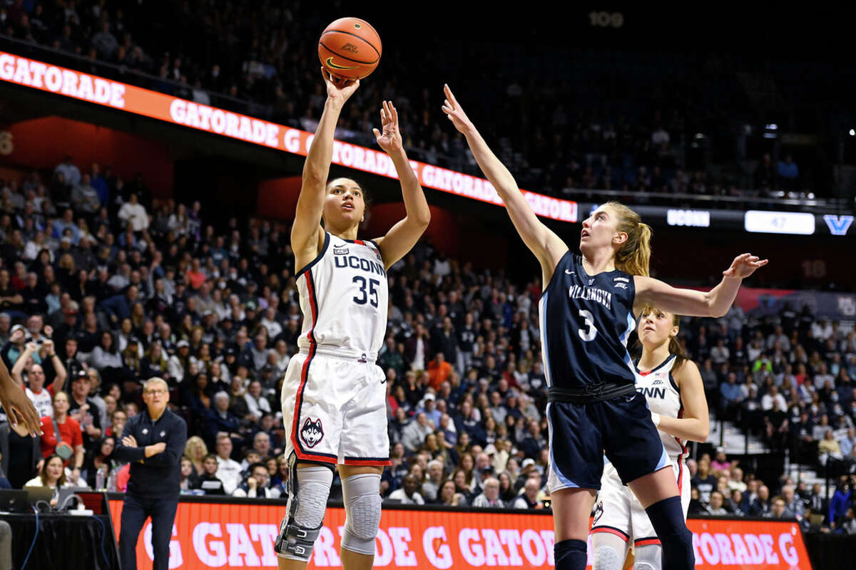 UConn's Azzi Fudd (35) shoots over Villanova's Lucy Olsen (3) during the second half of an NCAA college basketball game in the finals of the Big East Conference tournament Monday, March 6, 2023, in Uncasville, Conn. (AP Photo/Jessica Hill)