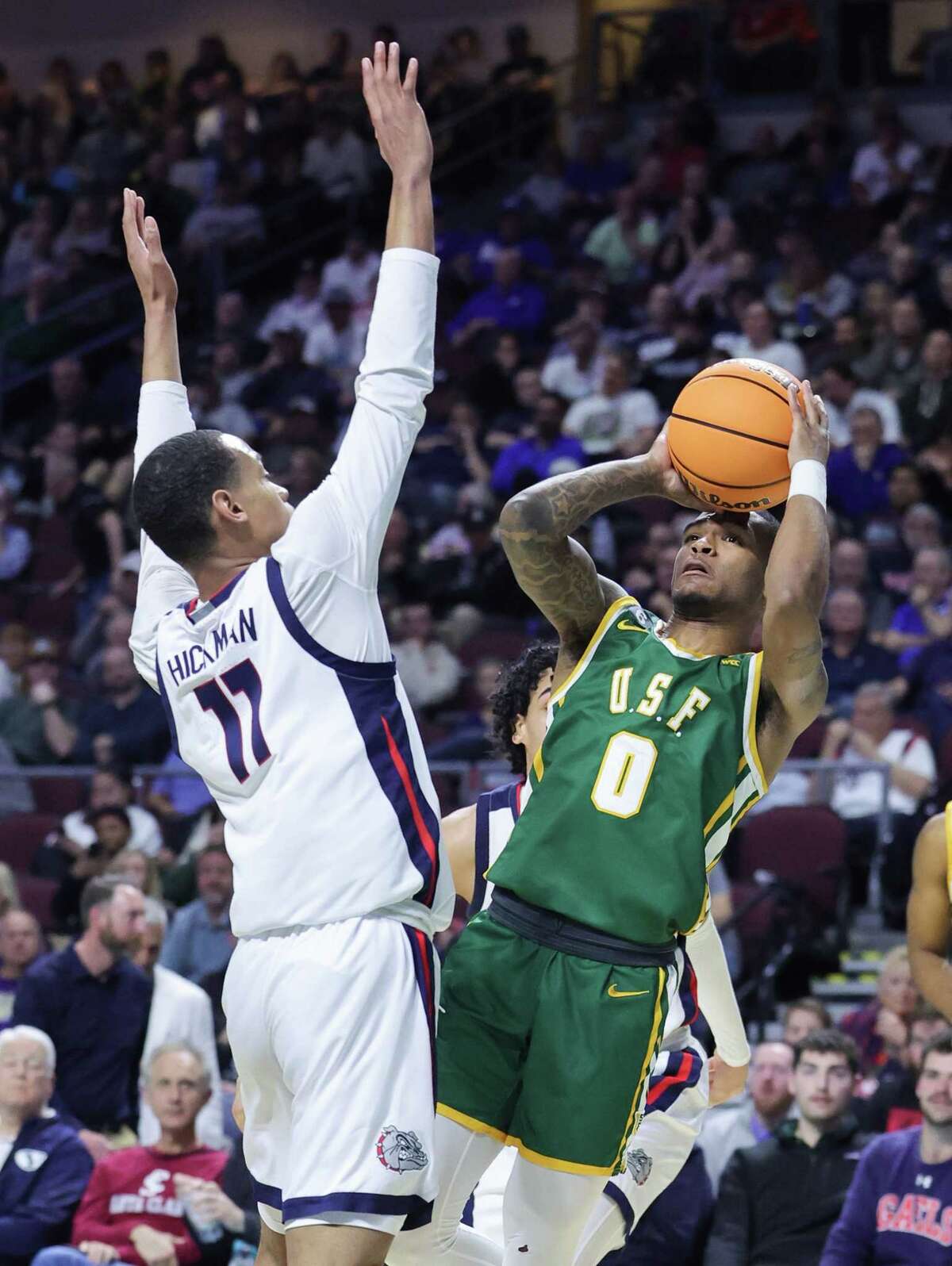 Khalil Shabazz of the USF Dons shoots against Nolan Hickman of the Gonzaga Bulldogs in the first half of a semifinal game of the West Coast Conference basketball tournament on Monday.