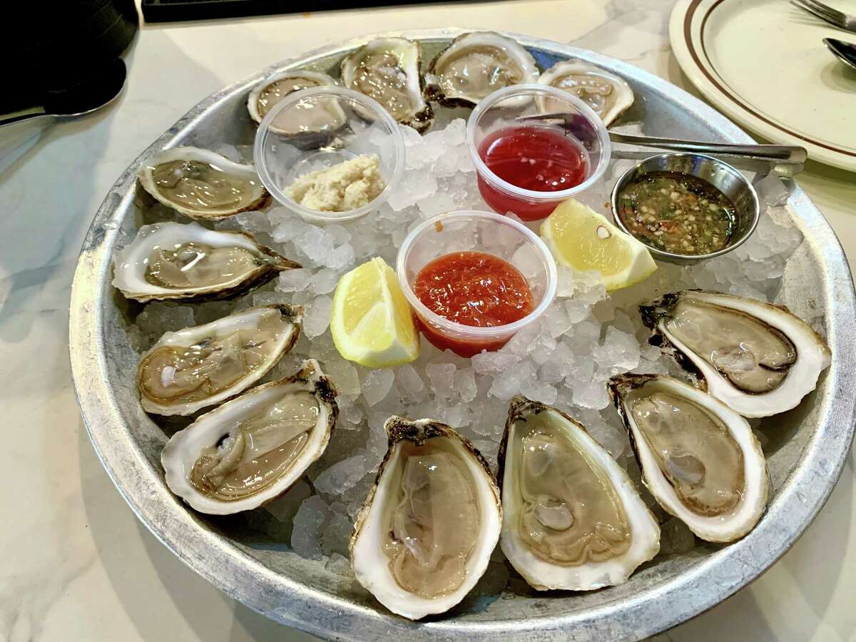 Three varieties of E Coast oysters with mignonette, chili sauce and cocktail sauce at Yummy Seafood & Oyster Bar in Katy Asian Town