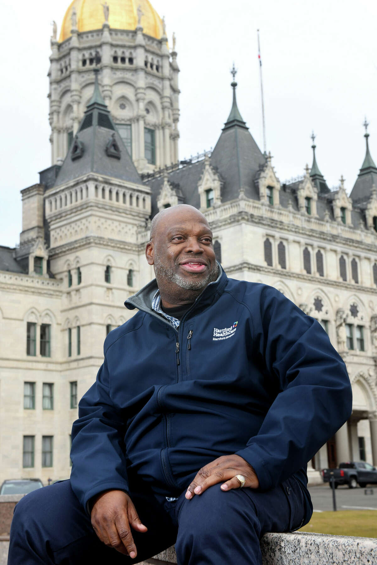 Mack Young smiles as he poses on the grounds of the Connecticut State Capitol, in Hartford, Conn. March 3, 2023. Young was released from state prison last year after serving nearly 30-years for a 1995 homicide conviction.