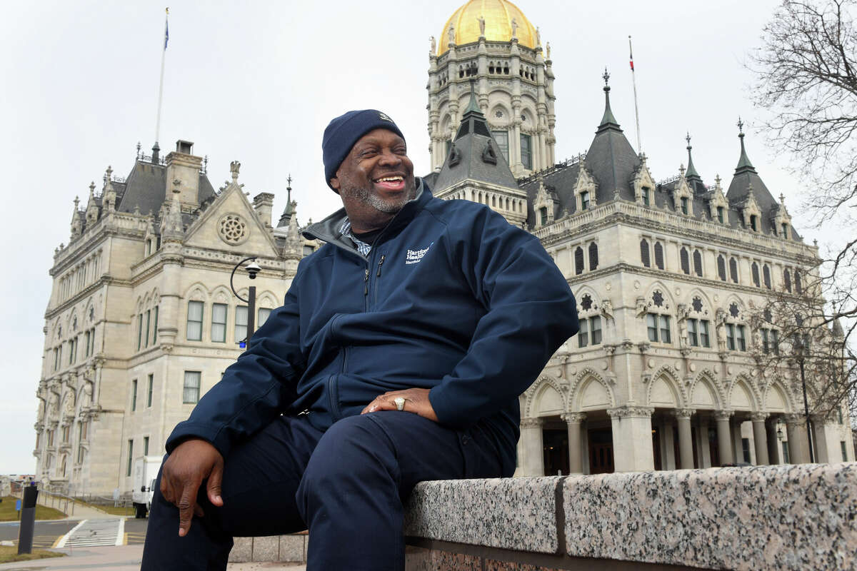 Mack Young smiles as he poses on the grounds of the Connecticut State Capitol, in Hartford, Conn. March 3, 2023. Young was released from state prison last year after serving nearly 30-years for a 1995 homicide conviction.