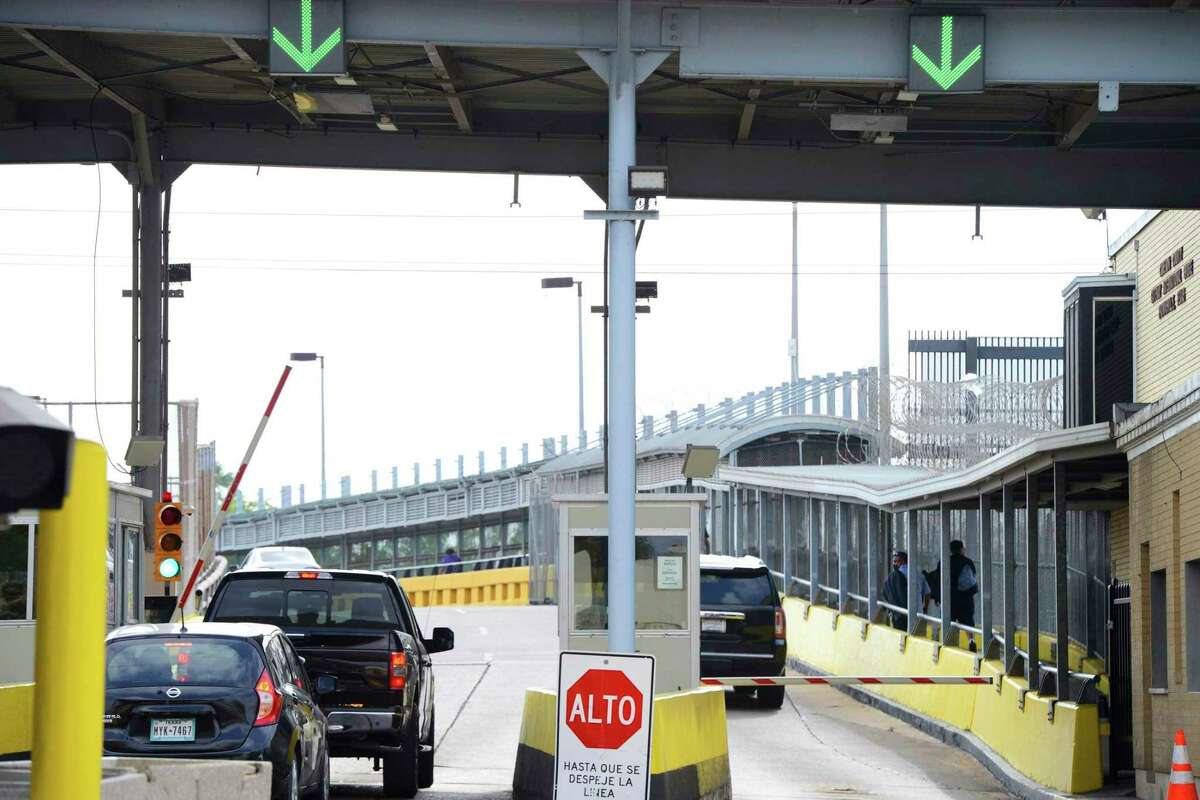 Motorists pay a bridge toll at Gateway International Bridge on Monday, March 6, 2023, in Brownsville, Texas, to cross into Matamoros, Mexico. (Miguel Roberts/The Brownsville Herald via AP)