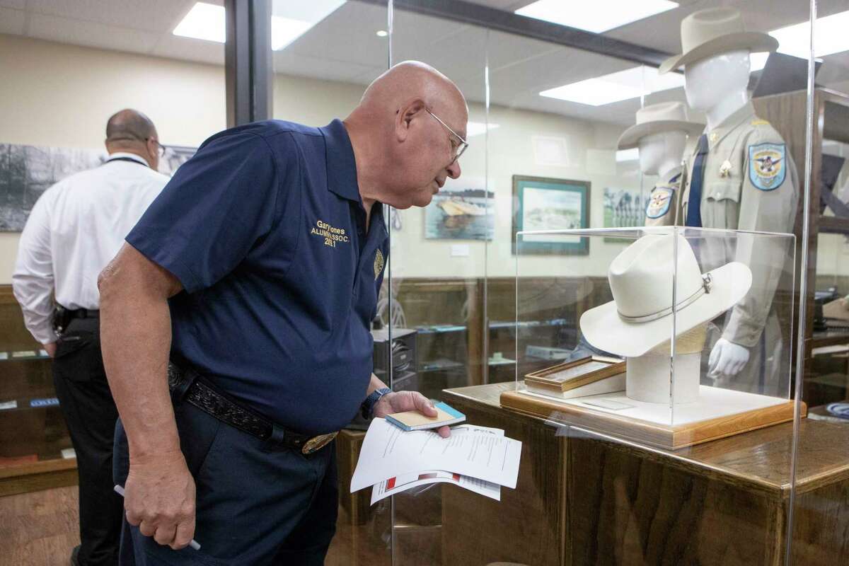 Gary Jones looks over a hat worn by Fannie Pearl Surratt, the only female sheriff in the Montgomery County Sheriff’s Department, displayed in the department’s museum honoring its 185-year history, Tuesday, March 7, 2023, in Conroe. The museum recently opened to the public.