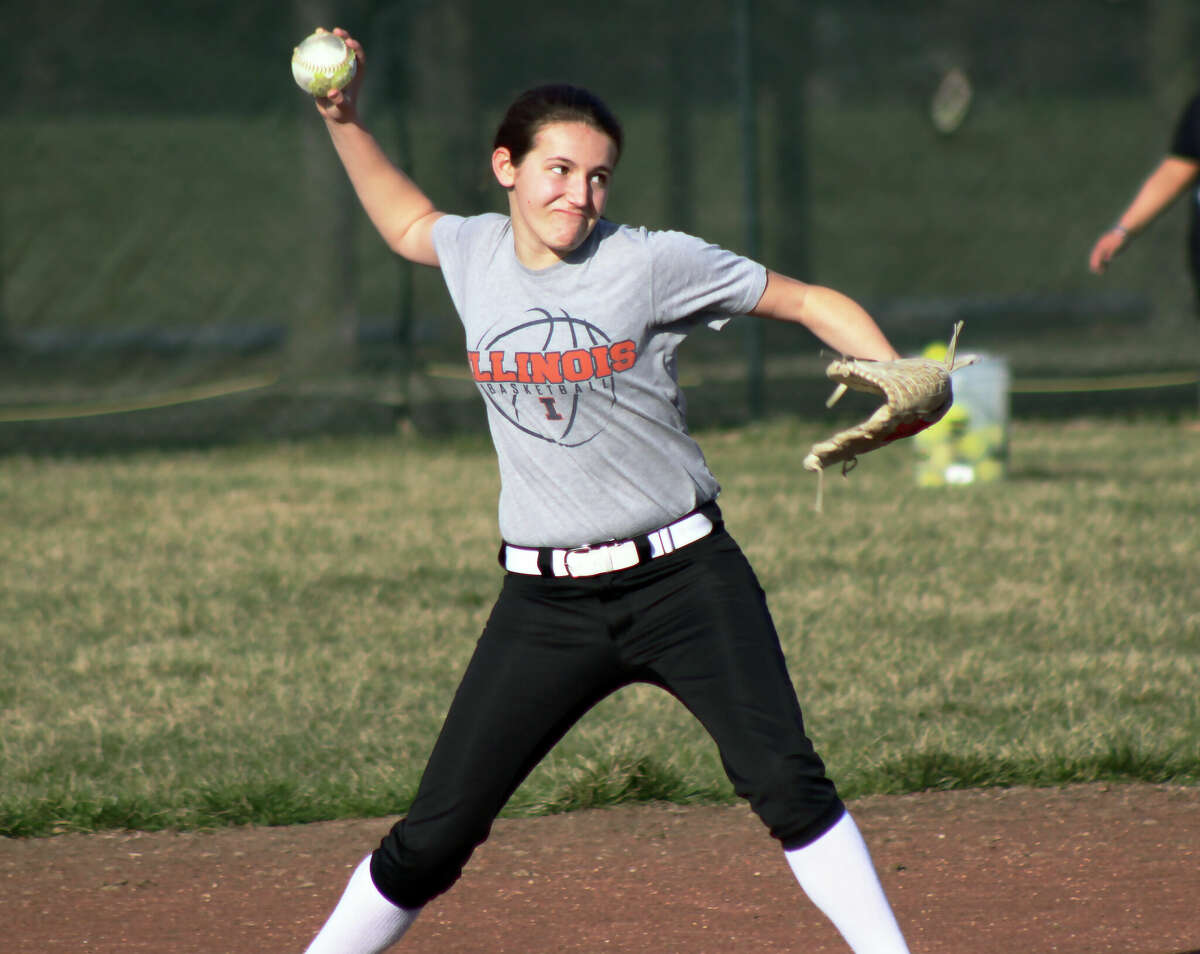 Sarah Huber fires a throw from shortstop to first base during practice ahead of the 2023 spring softball season. Huber returns at shortstop and pitcher for the Knights this spring. 