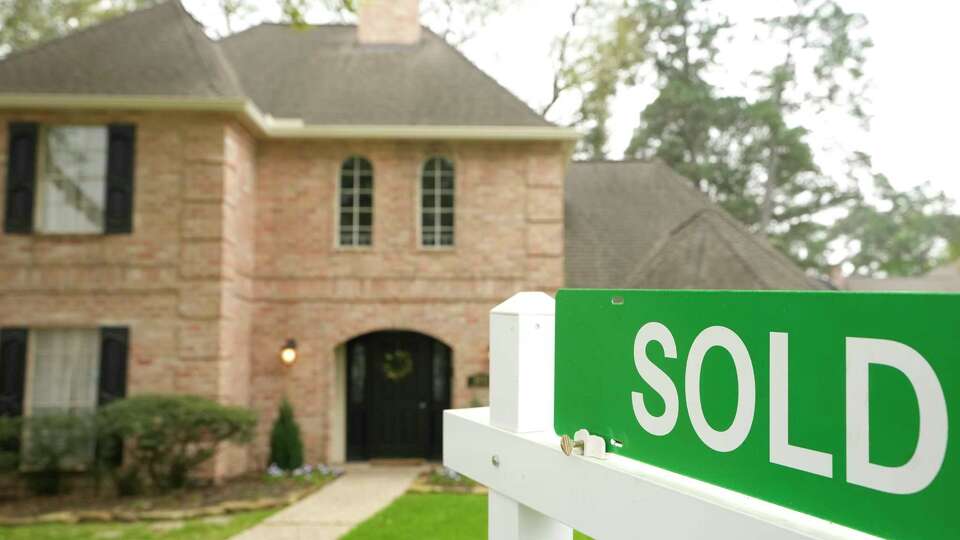 A sold sign is shown outside a home Tuesday, March 7, 2023, in Spring.