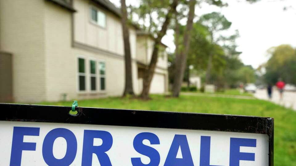 A for sale sign is shown outside a home Tuesday, March 7, 2023, in Spring.