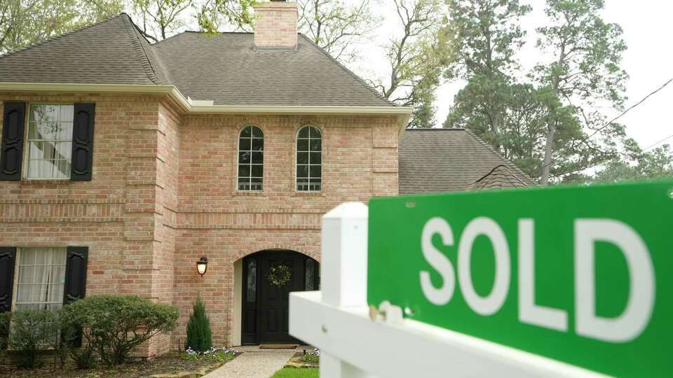 A sold sign is shown outside a home Tuesday, March 7, 2023, in Spring.