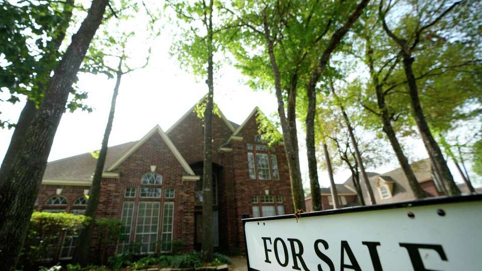 A for sale sign is shown outside a home Tuesday, March 7, 2023, in Spring.