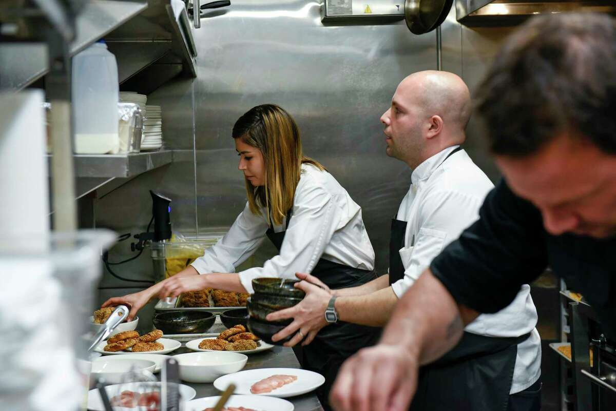 Laura and Sayat Ozyilmaz work in the kitchen during one of their Istanbul Modern pop-ups in San Francisco in 2017. The couple is now opening a new restaurant at the Presidio.