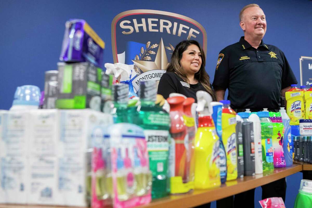 Sheriff Rand Henderson, right, stands alongside Siomara Rodriguez, with the Montgomery County Women’s Center, after the department recovered nearly $1,000 worth of cleaning supplies thieves were stealing from stores and reselling to second-hand businesses, Tuesday, March 7, 2023, in Conroe. The department donated the supplies to the nonprofit, which provides shelter, counseling, and transitional housing to victims of family violence and sexual assault.