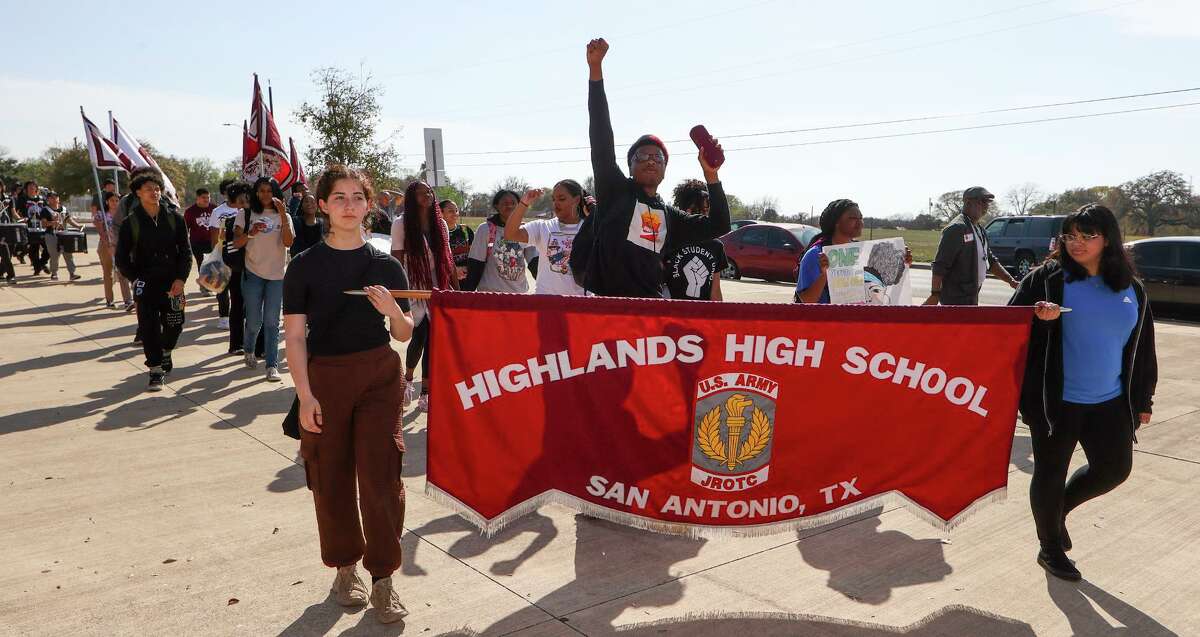 Students march in the debut of a Black History Month parade around Highlands High School on Tuesday, Feb. 28. The dance team cheer, pep squad, athletes and National Honor Society members participated in the parade.