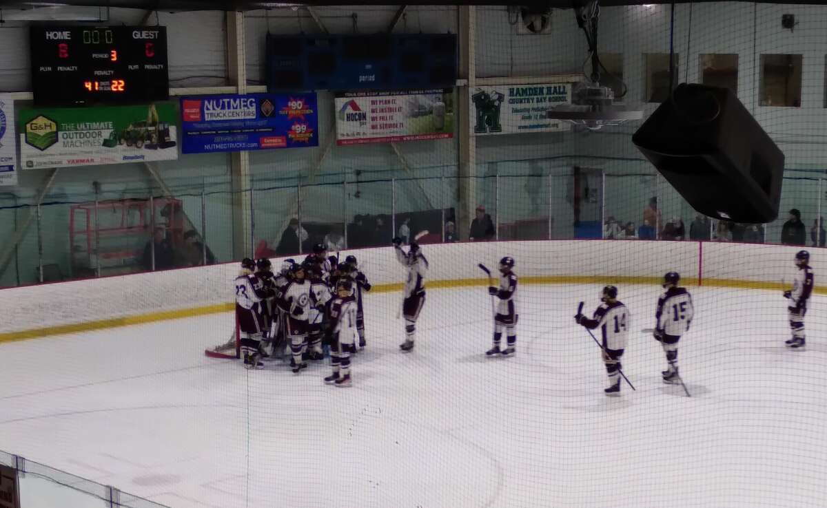 North Haven's boys hockey team celebrates an 8-0 win over Sheehan in the first round of the CIAC Division II playoffs on March 7, 2023, at Northford Ice Pavilion.