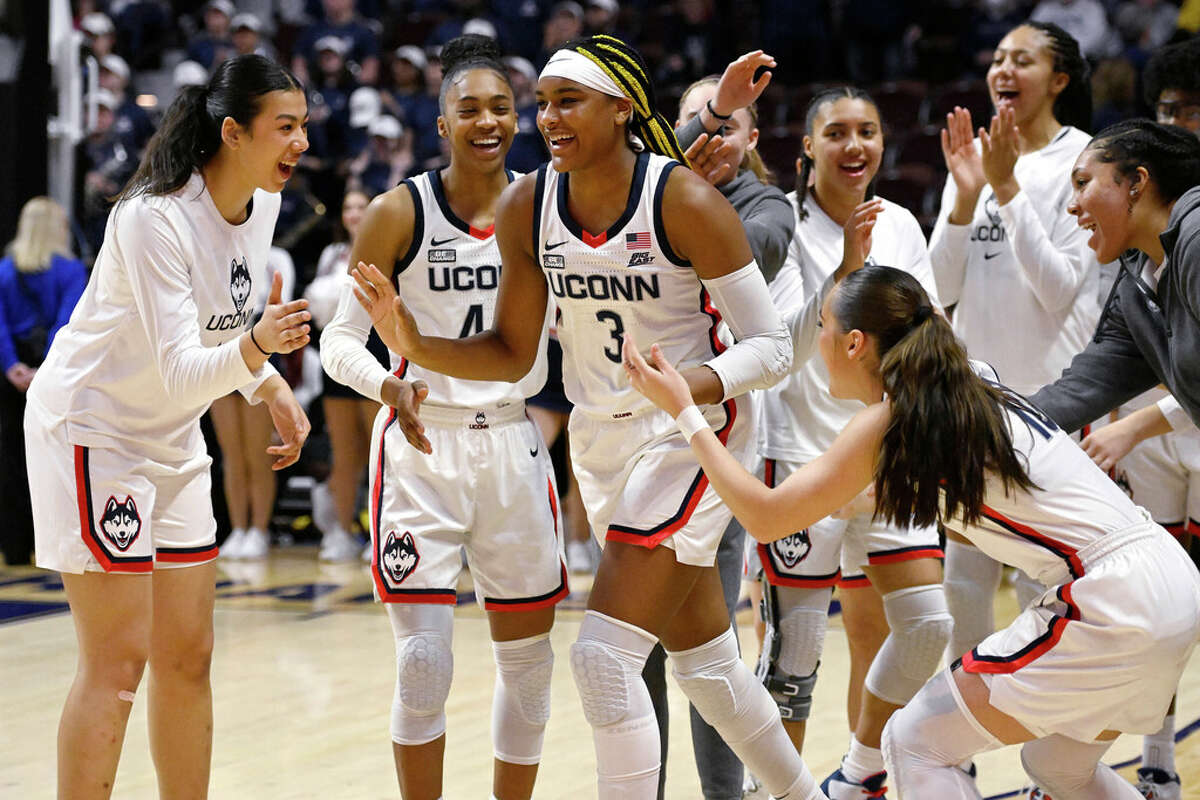 UConn's Aaliyah Edwards (3) is cheered on by her team as she is announced as the Big East Most Improved Player before an NCAA college basketball game against Georgetown in the quarterfinals of the Big East Conference tournament at Mohegan Sun Arena, Saturday, March 4, 2023, in Uncasville, Conn. (AP Photo/Jessica Hill)
