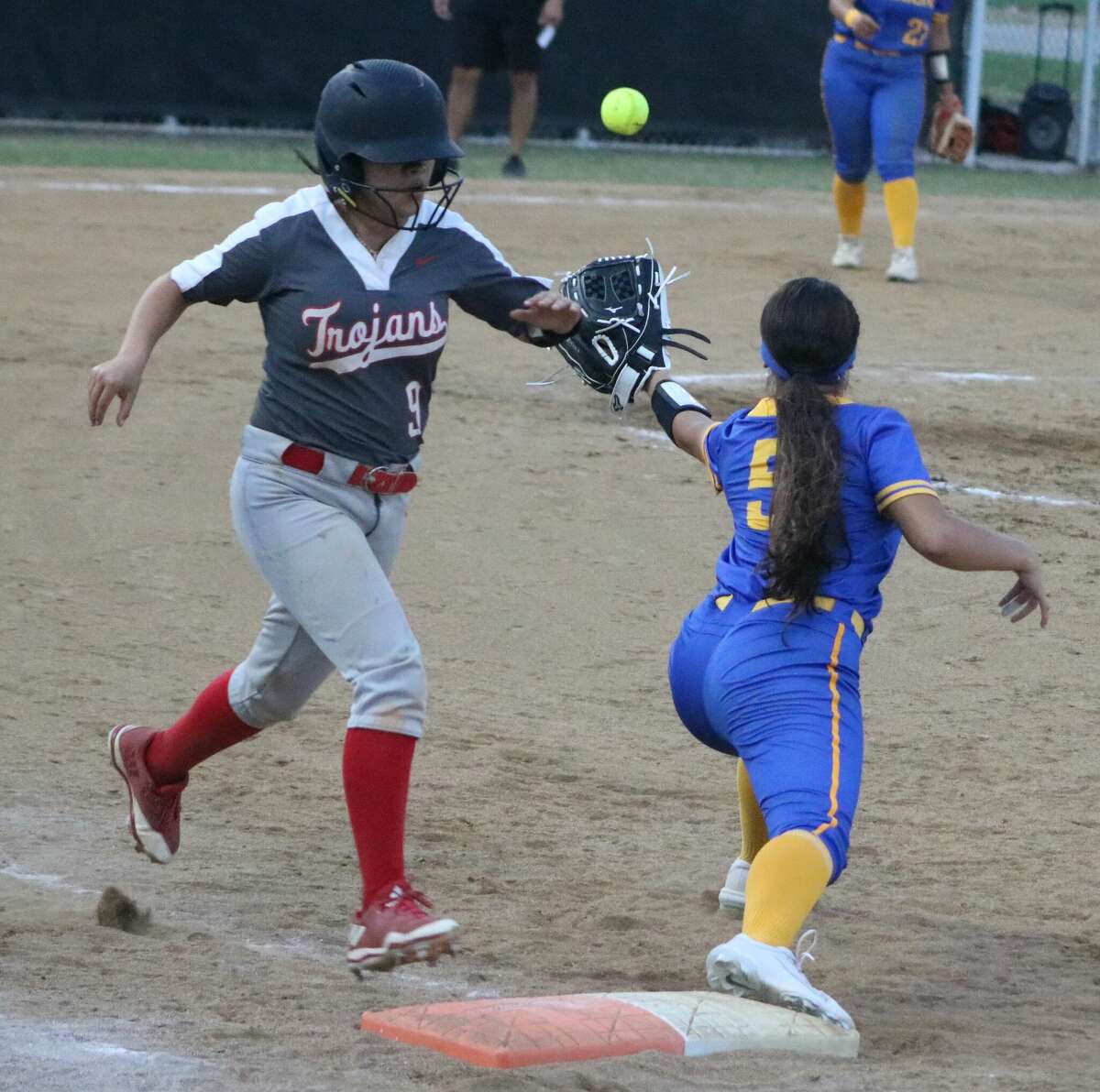 Channelview's Mia Mariscal reaches out for the across-the-diamond throw, but it failed to prevent South Houston's first batter of the game from reaching first base Tuesday night.