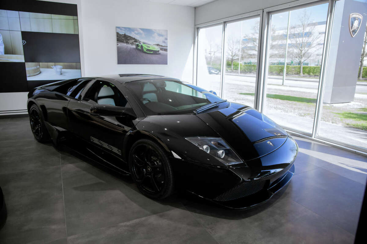  Lamborghini Murcielago Versace sits inside of a dealership.