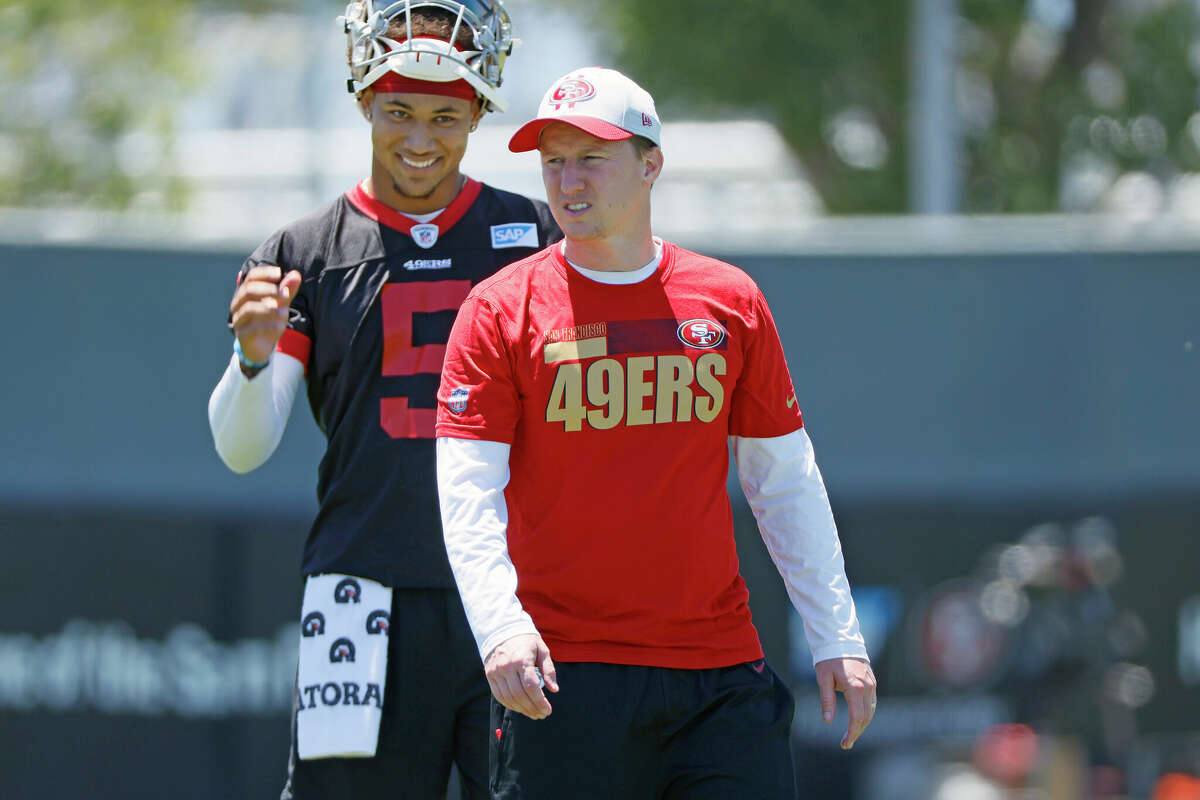 From left: San Francisco 49ers quarterback Trey Lance (5) and offensive passing game coordinator Bobby Slowik at the 49ers Training Facility on Wednesday, June 1, 2022, in Santa Clara, Calif.