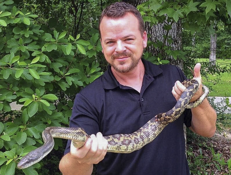 Facebook debate sparked after man seen taking pet snakes to