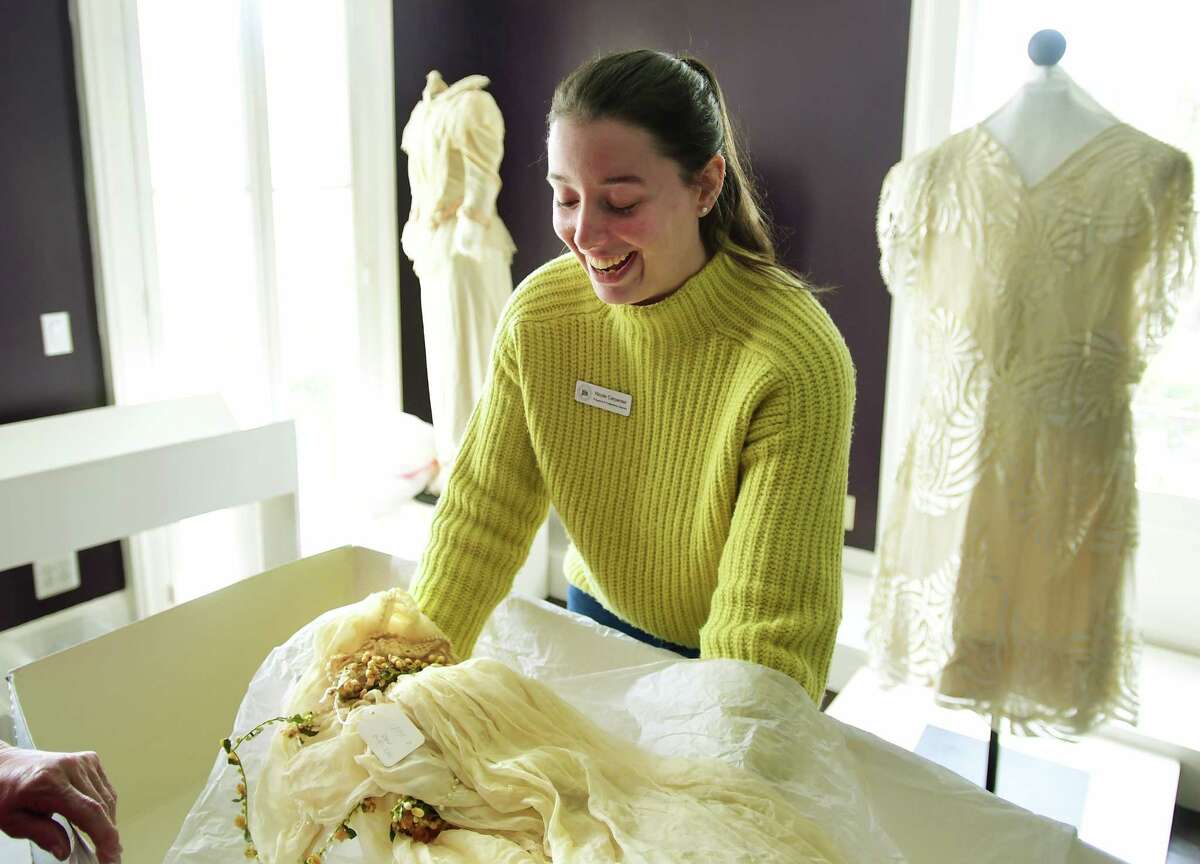 Programs and Collections Director Nicole Carpenter unboxes a 1920's bridal veil for display in the "I Thee Wed" exhibit of vintage wedding dresses at The Wesport Museum at 25 Avery Place in Westport, Conn. on Wednesday, March 08, 2023. The exhibit opens to the public on Friday, March 10.
