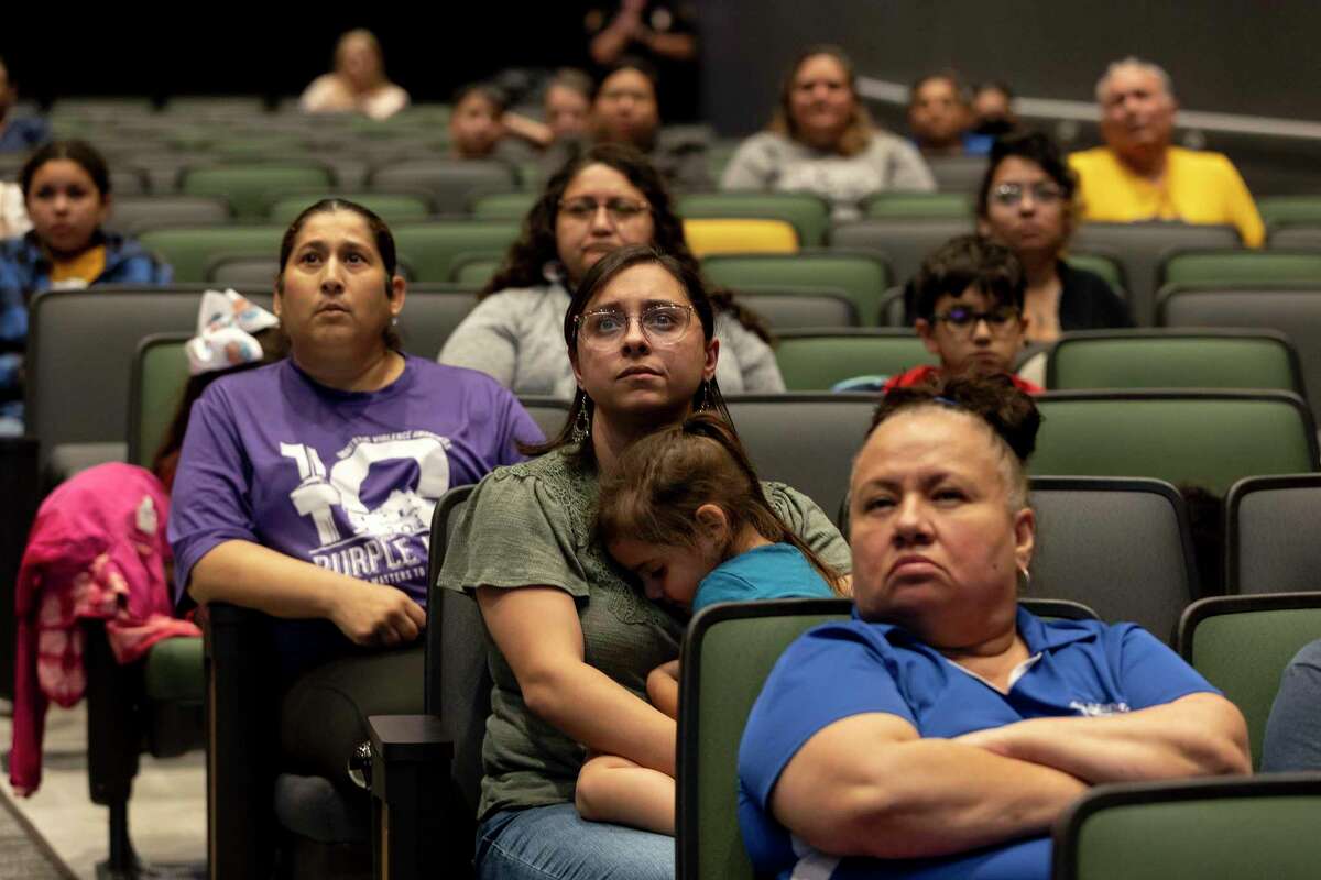 Parents, teachers and community members listen as Harlandale ISD Superintendent Gerardo Soto speaks at a town hall style meeting Tuesday at McCollum High School about possible school closures.