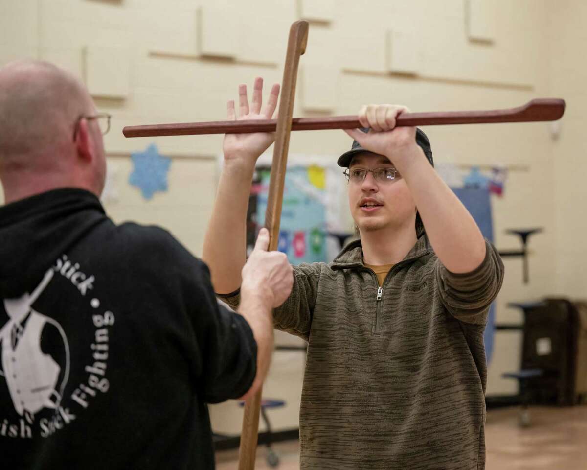 John Borter, left, teaches an Irish stick fighting move to Logan Pieper at the Coxsackie Elementary School on Saturday, March 4, 2023, in Coxsackie, NY.