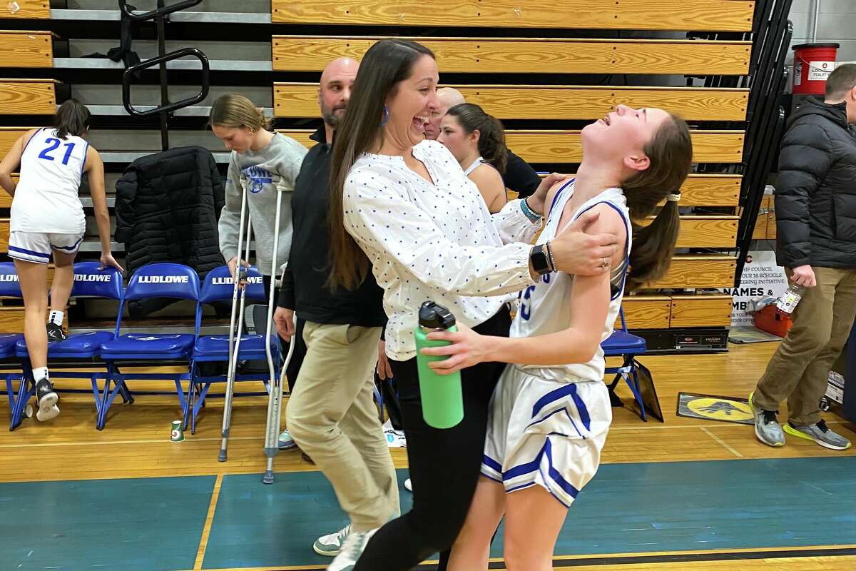 Ludlowe coach Sara Kinsley celebrates with senior Rory Kudzy after Ludlowe defeated Conard in the Class LL quarterfinals.