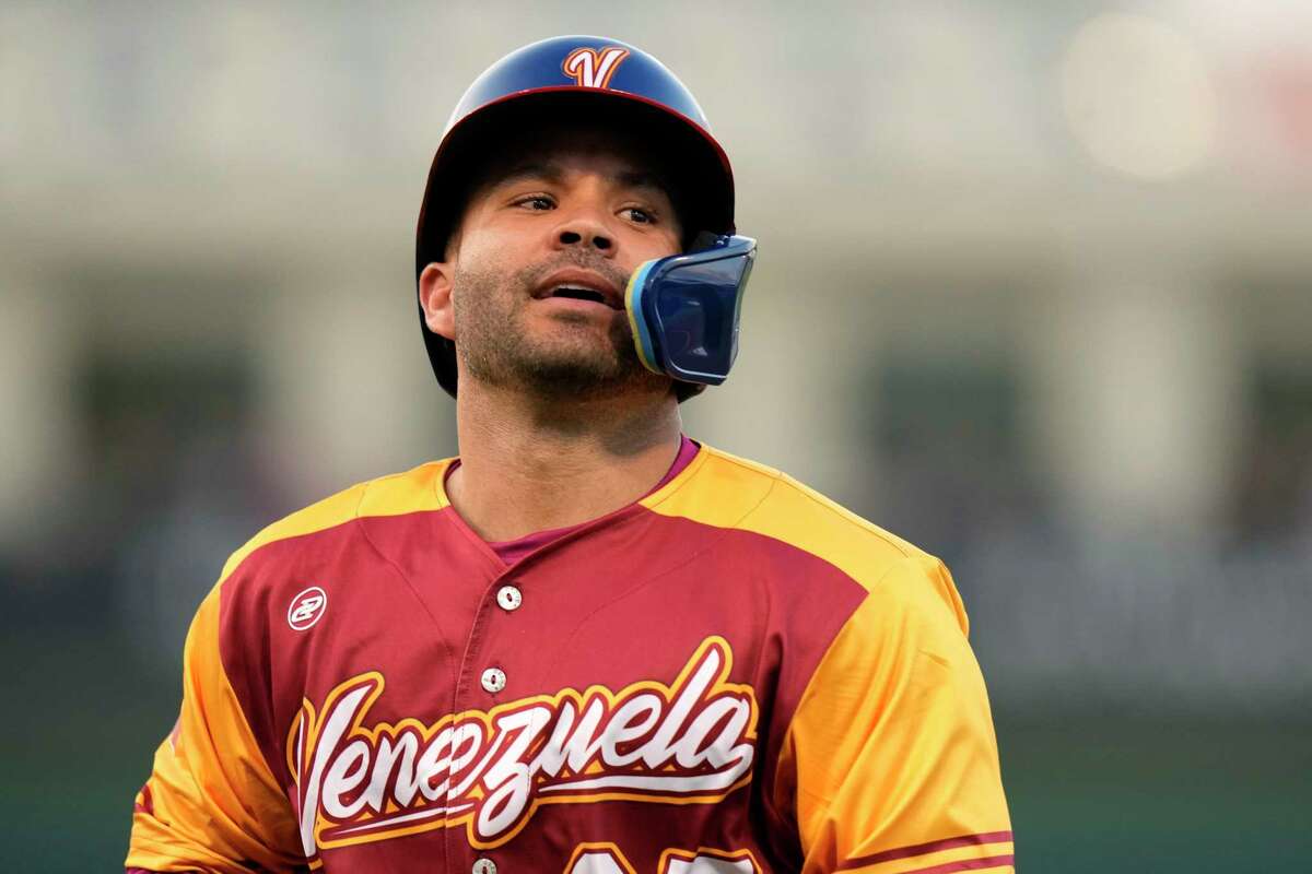 Venezuela's Jose Altuve goes to the dugout after he was out stealing second during the first inning of an exhibition baseball game against the Houston Astros, Wednesday, March 8, 2023, in West Palm Beach, Fla. (AP Photo/Lynne Sladky)