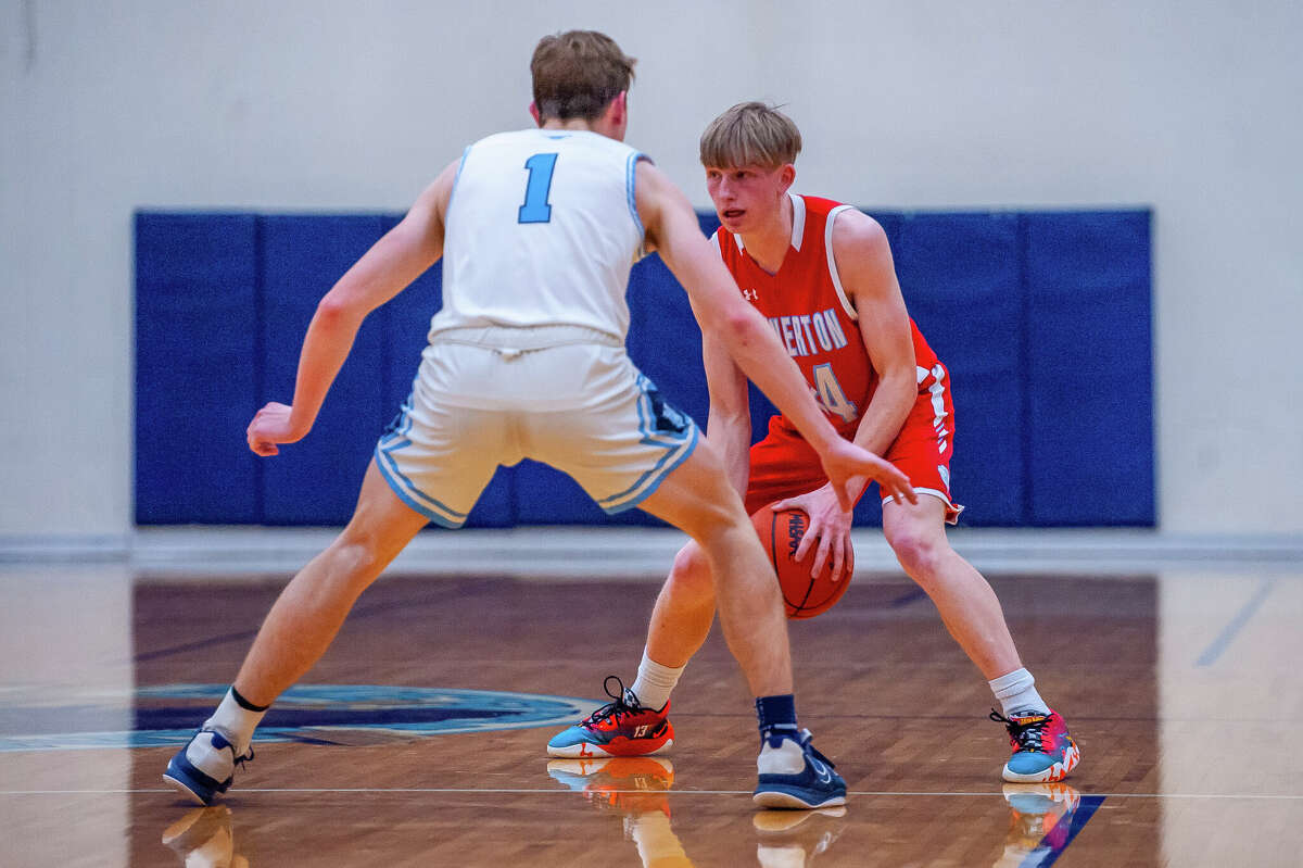 Meridian's Madix Saunders guards Beaverton's George Killian during Wednesday's district semifinal, March 8, 2023.
