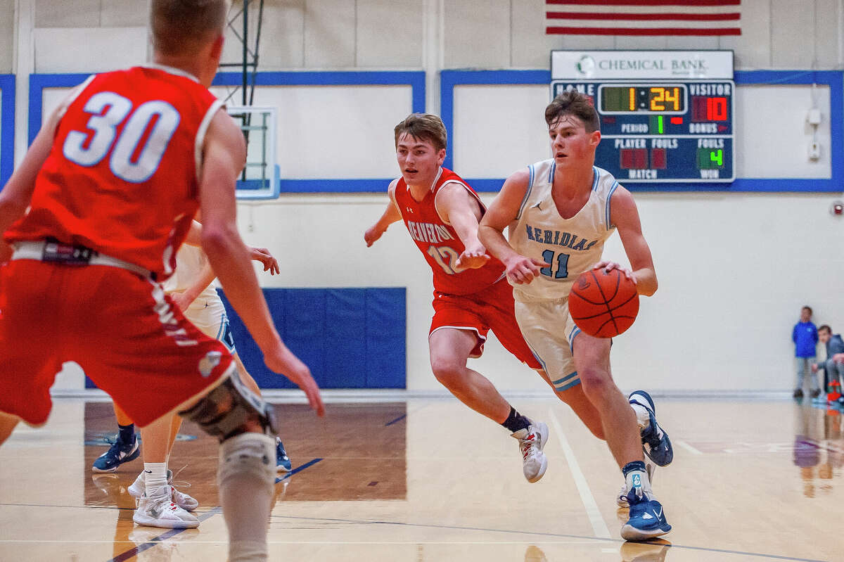 Meridian's Nick Metzger attacks off the dribble during Wednesday's district semifinal against Beaverton, March 8, 2023.