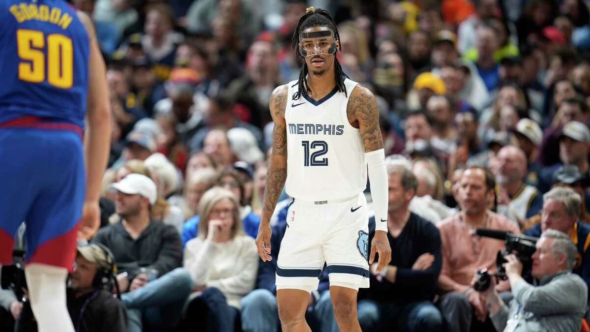 Memphis Grizzlies guard Ja Morant (12) in the second half of an NBA basketball game Friday, March 3, 2023, in Denver. (AP Photo/David Zalubowski)