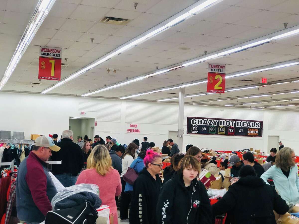 Shoppers hunt for discounted items at Crazy Hot Deals in Manchester. The discount store sells all of its merchandise at one price that decreases uniformly throughout the week.