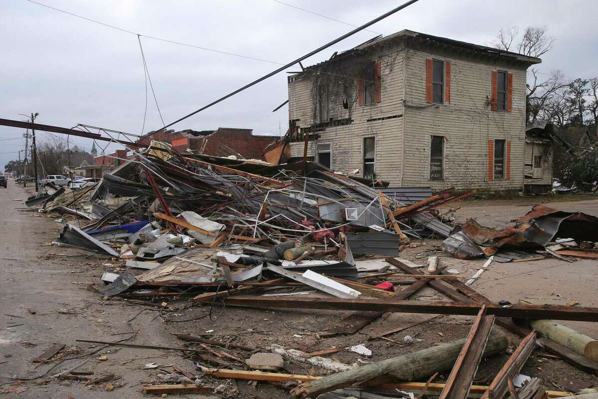 FILE - Debris from local businesses covers the street in Selma, Ala., Friday, Jan. 13, 2023, after a tornado passed through the area. After three nasty years, the La Nina weather phenomenon is gone, the National Oceanic and Atmospheric Administration said Thursday, March 9.