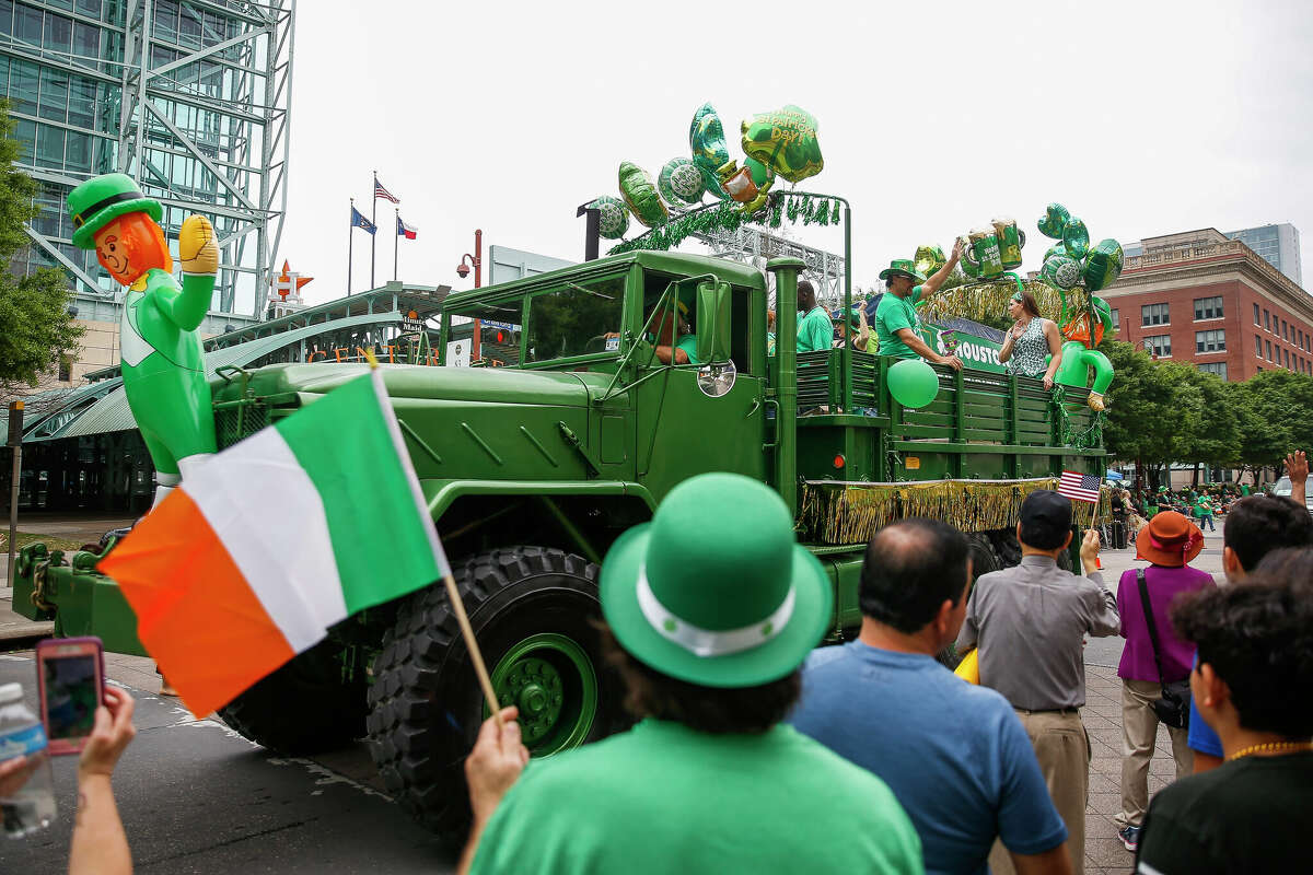 People watch as the 59th Annual Houston St. Patrick's Parade passes by Minute Maid Park Saturday, March 17, 2018 in Houston. (Michael Ciaglo / Houston Chronicle)