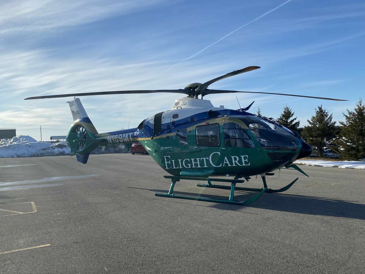 A chopper from the AirMedCare Network sits in the Tech Center parking lot.