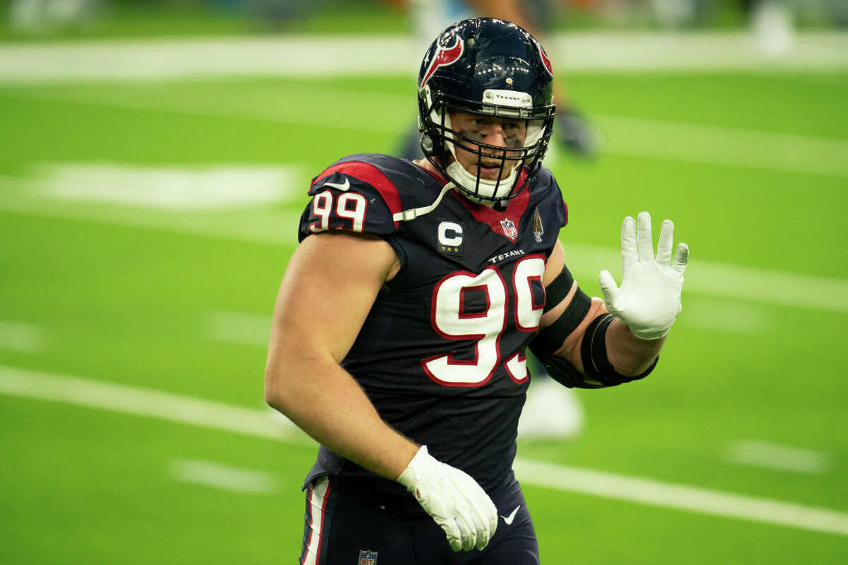 J.J. Watt #99 of the Houston Texans motions towards the sideline during an NFL game against the Tennessee Titans on January 03, 2021 in Houston, Texas.