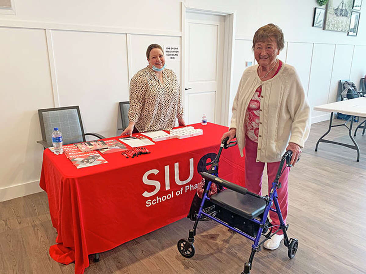 A representative from the SIUE School of Pharmacy meets with a client at last year’s Senior Health Fair at Main Street Community Center in Edwardsville. This year’s event is scheduled for March 29.