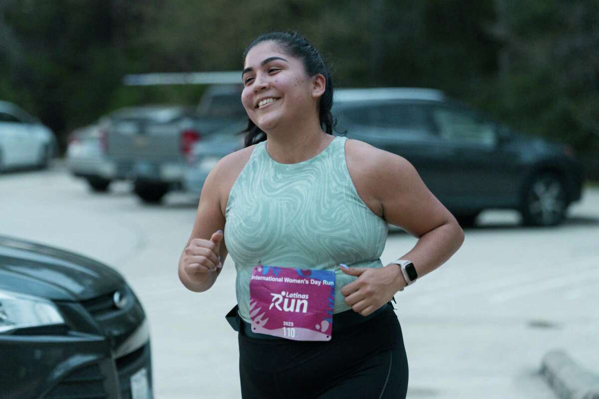 Ashley Mondragon runs by during an event celebrating International Women’s Day in Willowbrook on Wednesday, March 8, 2023.