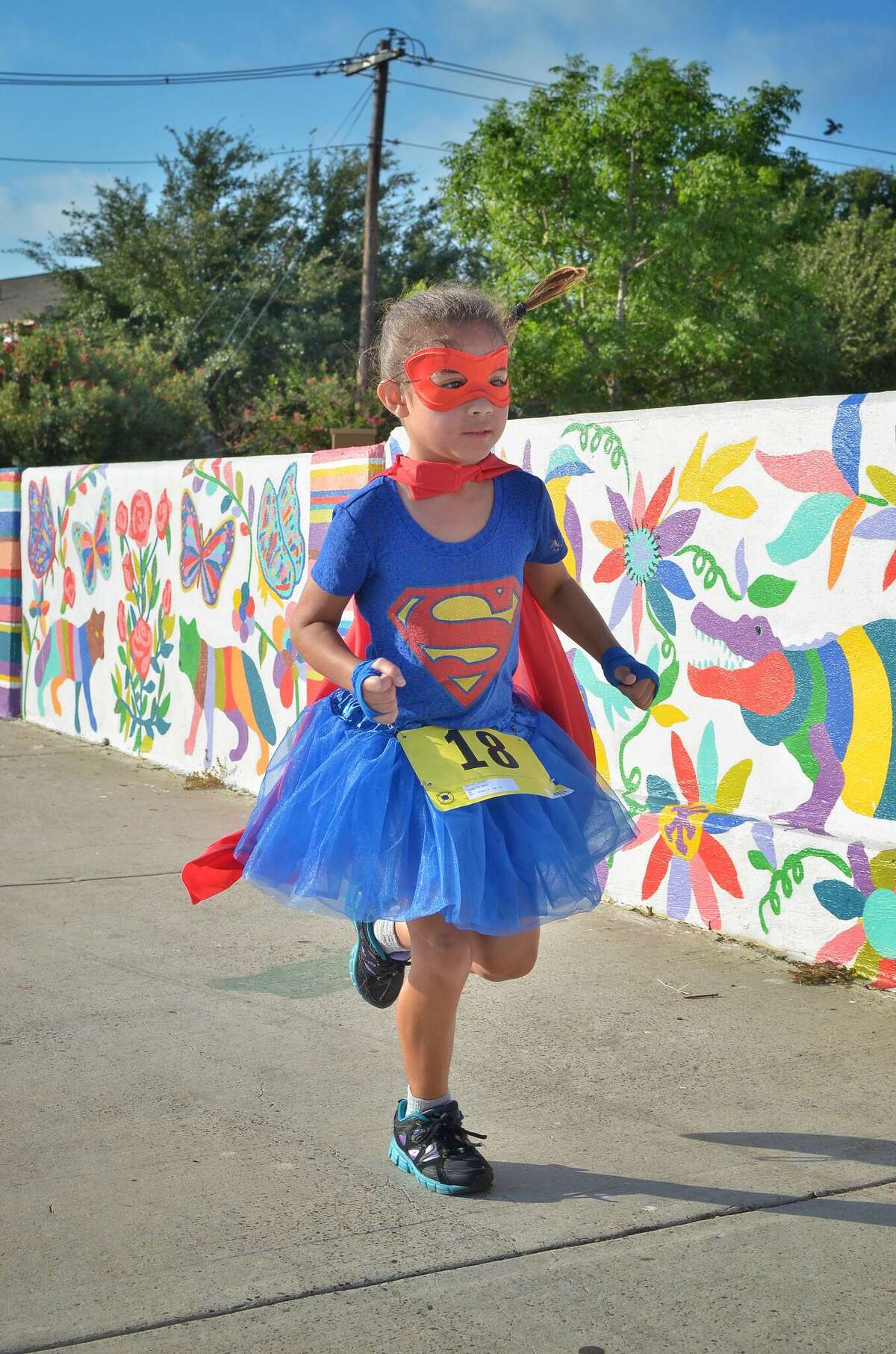 Runners participate in the CASA Superhero 5K and Family Fun Walk on June 17, 2017 at North Central Park.