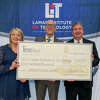 Texas Mutual Insurance Company presented a $100,000 grant to Lamar Institute of Technology President Sidney Valentine, right, Wednesday.
