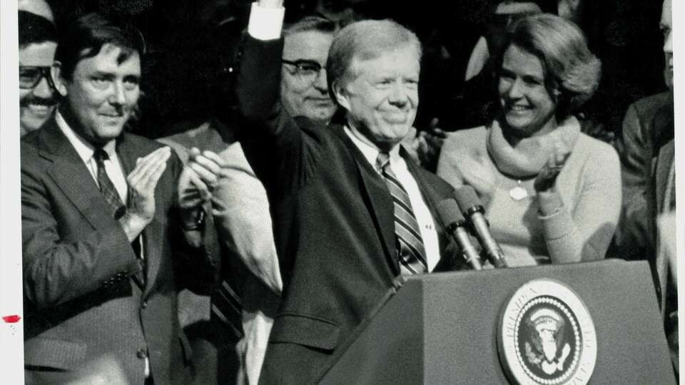 President Carter smiles as he acknowledges cheers at a crowded Miller Outdoor Theatre. President Jimmy Carter following speech tonight at Miller Theatre during Houston visit.